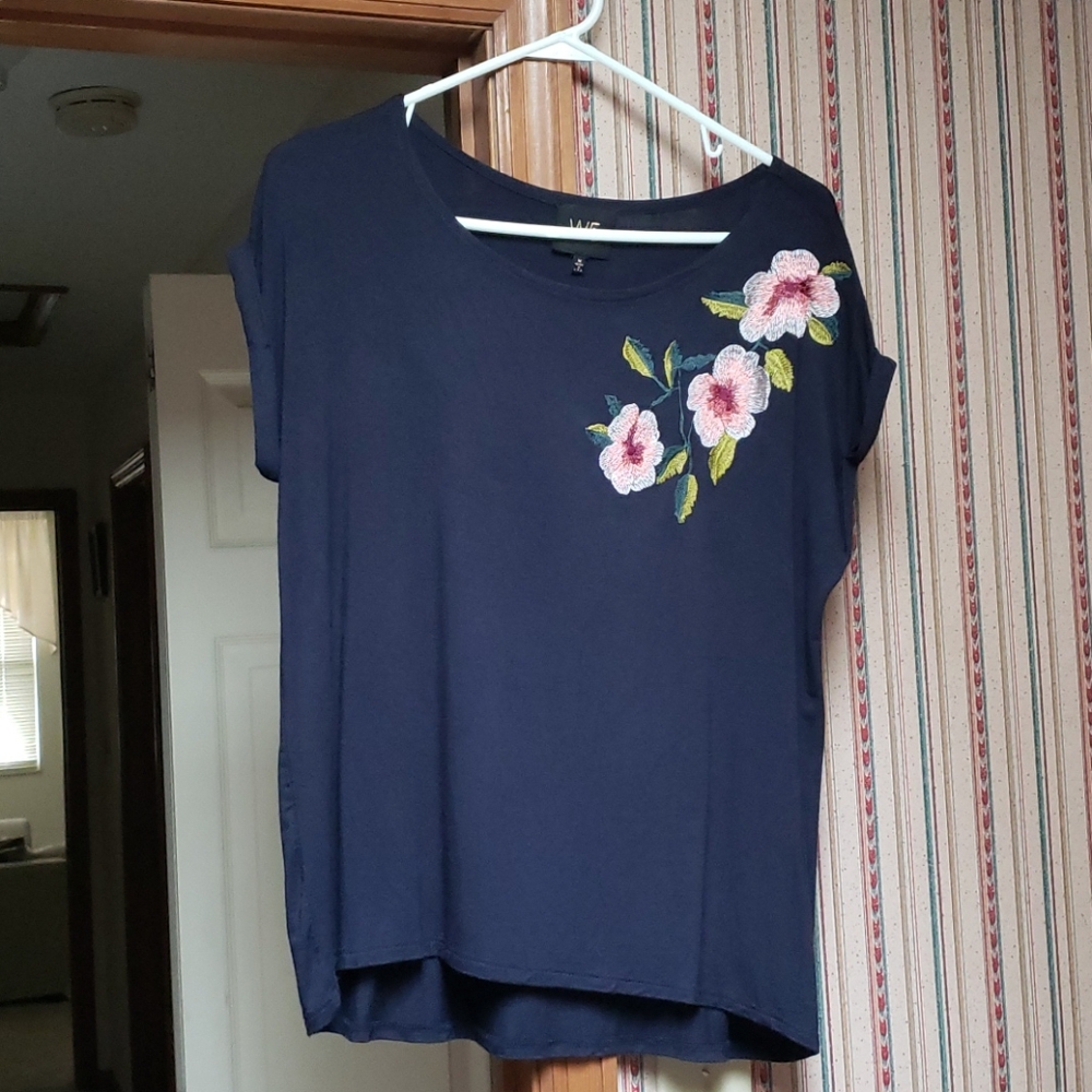Top with embroidery flowers on upper left side